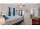 Comfortable bedroom featuring a bed with decorative pillows and ensuite bathroom at 7339 Millstone Sw Cir, Concord, NC 28025