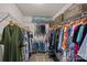Walk-in closet featuring shelving for organization and hanging space at 7339 Millstone Sw Cir, Concord, NC 28025