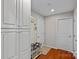 Hallway with storage cabinets and access to the garage at 7339 Millstone Sw Cir, Concord, NC 28025