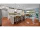 Spacious kitchen with granite countertops, stainless appliances, and dining area at 7339 Millstone Sw Cir, Concord, NC 28025