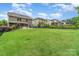 The large backyard features a well-manicured lawn, screened porch, and fence at 755 Lagan Ct, Fort Mill, SC 29715