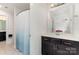 Well-lit bathroom featuring a dark vanity with ample storage space and a separate shower area at 755 Lagan Ct, Fort Mill, SC 29715