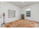 Sunlit bedroom with neutral walls, decorative rug, a window, and armoire at 755 Lagan Ct, Fort Mill, SC 29715