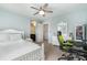Serene bedroom with neutral walls, ceiling fan, and a dedicated workspace for study or creative pursuits at 755 Lagan Ct, Fort Mill, SC 29715