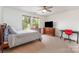 Cozy bedroom with natural light, a TV and dedicated workspace offering a comfortable and productive atmosphere at 755 Lagan Ct, Fort Mill, SC 29715