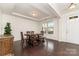 Bright dining room with hardwood floors, tray ceiling, and natural light from the window at 755 Lagan Ct, Fort Mill, SC 29715