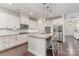 Well-lit kitchen featuring white cabinetry, granite countertops, and stainless steel appliances at 755 Lagan Ct, Fort Mill, SC 29715