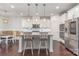 Bright, modern kitchen with white cabinets, stainless steel appliances, and a large island at 755 Lagan Ct, Fort Mill, SC 29715
