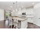 Bright, modern kitchen with white cabinets, a granite island, and stylish pendant lighting at 755 Lagan Ct, Fort Mill, SC 29715