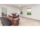 Inviting living area with large windows offering serene views of the outdoors and comfortable seating at 755 Lagan Ct, Fort Mill, SC 29715