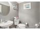 Charming half bathroom featuring a pedestal sink and modern fixtures at 8108 Christmas Ct, Charlotte, NC 28216