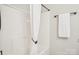 Bathroom showcasing a crisp white shower and a towel rack featuring a neatly hung towel for a fresh look at 8108 Christmas Ct, Charlotte, NC 28216