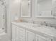 Elegant bathroom with marble countertops, dual sinks, and modern fixtures at 8108 Christmas Ct, Charlotte, NC 28216