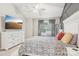 Well-lit bedroom featuring a large TV, neutral tones, and a comfortable bed at 8108 Christmas Ct, Charlotte, NC 28216