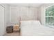 Inviting bedroom featuring a tufted headboard and bright natural light at 8108 Christmas Ct, Charlotte, NC 28216