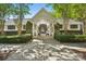 Inviting entrance to a community building with mature trees and landscaping that create a welcoming atmosphere at 8108 Christmas Ct, Charlotte, NC 28216