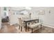 Elegant dining area with a modern table, comfortable seating, and seamless flow to other rooms at 8108 Christmas Ct, Charlotte, NC 28216