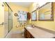 Charming bathroom with a glass-enclosed shower, framed mirrors, and floral-themed decor at 839 Montford Dr, Charlotte, NC 28209