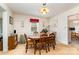 Traditional dining room with a wooden table and chairs, classic light fixture, and cozy ambiance at 839 Montford Dr, Charlotte, NC 28209