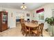 Traditional dining room with a large wooden table, decorative accents, and abundant natural light at 839 Montford Dr, Charlotte, NC 28209