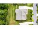 Aerial view of the home showcasing the roof, driveway, and surrounding landscaping at 8709 Raven Top Dr, Mint Hill, NC 28227