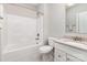 A bright bathroom features a tub shower, toilet, and vanity with light countertop at 8709 Raven Top Dr, Mint Hill, NC 28227