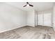 A spacious bedroom features neutral carpeting, a ceiling fan, and two closets at 8709 Raven Top Dr, Mint Hill, NC 28227