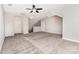 Spacious bonus room featuring a ceiling fan and multiple doors, with neutral colored walls at 8709 Raven Top Dr, Mint Hill, NC 28227