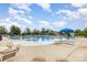 Large community pool featuring ample seating, umbrellas, and a relaxing atmosphere at 8709 Raven Top Dr, Mint Hill, NC 28227