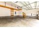 Spacious two-car garage with storage racks and stairs to upper level at 8709 Raven Top Dr, Mint Hill, NC 28227