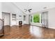 Spacious living room with fireplace, built-in shelving, high ceilings, and lots of natural light at 8709 Raven Top Dr, Mint Hill, NC 28227