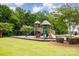 Community playground with slides, swings, and climbing structures, perfect for Gathering fun at 8709 Raven Top Dr, Mint Hill, NC 28227