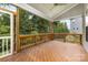 A screened-in porch provides outdoor seating and view of treed backyard at 8709 Raven Top Dr, Mint Hill, NC 28227