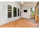 A screened-in porch offers an outdoor space to relax and enjoy wooded views at 8709 Raven Top Dr, Mint Hill, NC 28227