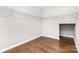 Spacious walk-in closet featuring hardwood floors and wire shelving for optimal storage at 8709 Raven Top Dr, Mint Hill, NC 28227