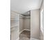 Walk-in closet with white shelving and natural light at 933 Old Charlotte Rd, Concord, NC 28027