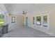 Spacious front porch featuring a ceiling fan and multiple windows, perfect for relaxing outdoors at 933 Old Charlotte Rd, Concord, NC 28027