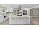 Spacious kitchen with granite countertops, stainless steel appliances, and an island at 933 Old Charlotte Rd, Concord, NC 28027