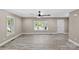 Inviting living room featuring hardwood floors, neutral paint, and ample natural light at 933 Old Charlotte Rd, Concord, NC 28027