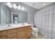Bathroom with double sinks, a toilet, and a shower with curtains at 1012 Kings Bottom Dr, Fort Mill, SC 29715