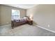 Bedroom with a twin bed and a bright window at 1012 Kings Bottom Dr, Fort Mill, SC 29715