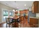 Eat-in kitchen with an island, stainless appliances, granite countertops and hardwood floors at 1012 Kings Bottom Dr, Fort Mill, SC 29715