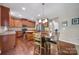 Eat-in kitchen with an island, stainless appliances, granite countertops and hardwood floors at 1012 Kings Bottom Dr, Fort Mill, SC 29715