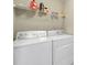 Bright laundry room featuring a modern washer and dryer, plus storage shelving at 1012 Kings Bottom Dr, Fort Mill, SC 29715