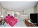 Bright loft area with comfortable seating, neutral walls, and a cozy ambiance, creating a relaxing space at 1012 Kings Bottom Dr, Fort Mill, SC 29715