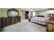 Expansive main bedroom features a large dresser, mirror, windows, and a ceiling fan at 1012 Kings Bottom Dr, Fort Mill, SC 29715
