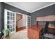 Sophisticated office space featuring a large desk, built-in shelving, and French doors at 1012 Kings Bottom Dr, Fort Mill, SC 29715