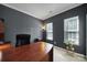 Cozy home office with a stylish desk, ambient lighting, and views through bright windows at 1012 Kings Bottom Dr, Fort Mill, SC 29715