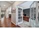 Stylish home office with French doors, modern desk, and plenty of natural light at 1012 Kings Bottom Dr, Fort Mill, SC 29715
