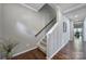 Hallway staircase featuring wooden floors, neutral paint, and decorative vase at 1012 Kings Bottom Dr, Fort Mill, SC 29715
